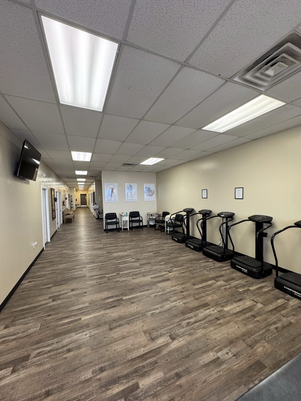 Therapy equipment along a clinic hallway inside Missouri Injury Clinic